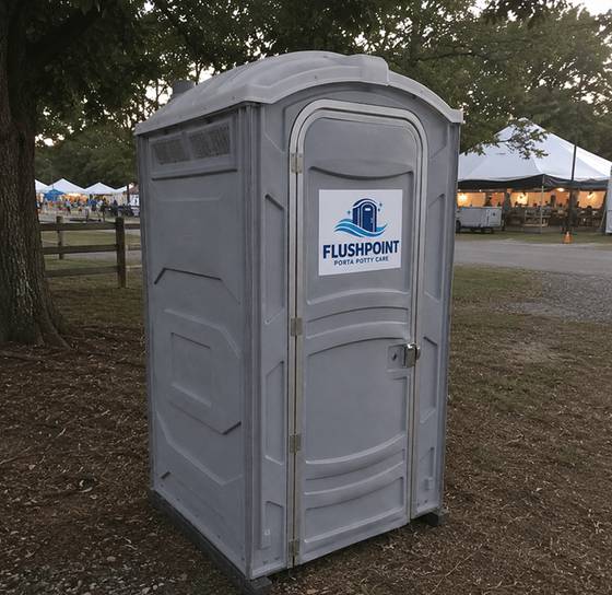 Portable toilet unit at an evening outdoor event